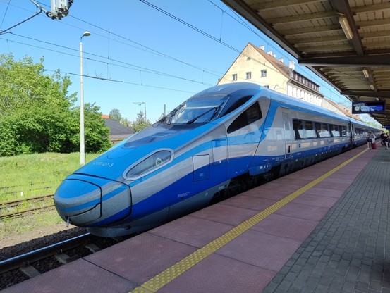 Photo of a Pendolino bullet train taken from the front at an angle.