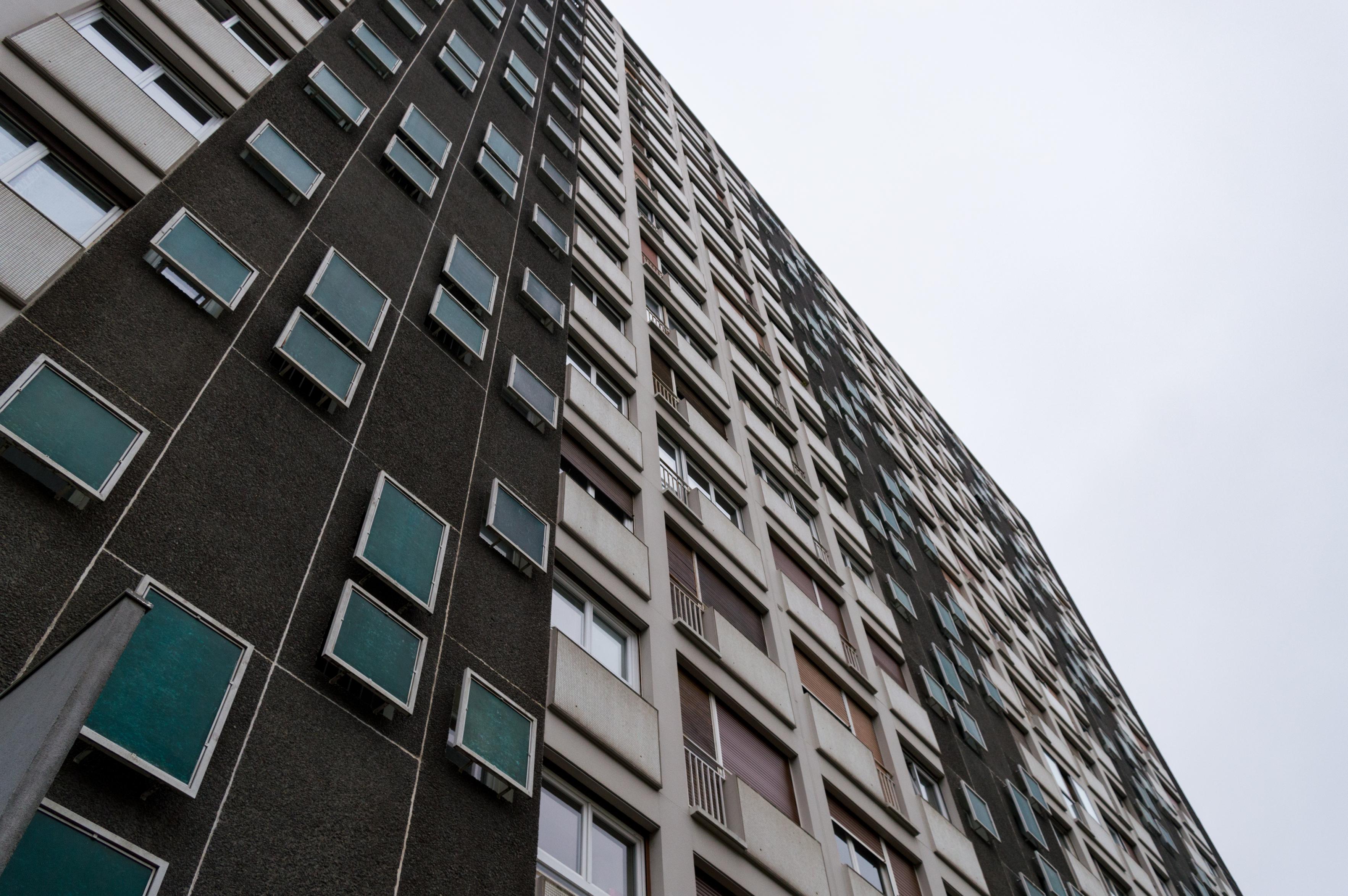 An old multi-story residential building photographed from up close