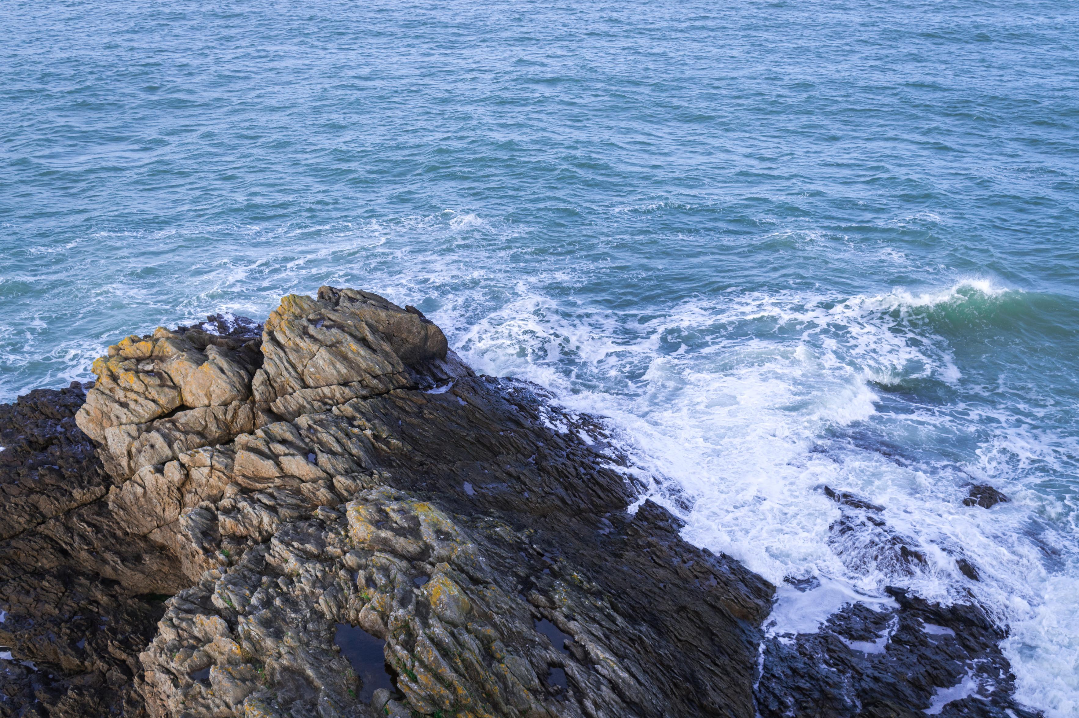 Water hitting some rocks near the shore